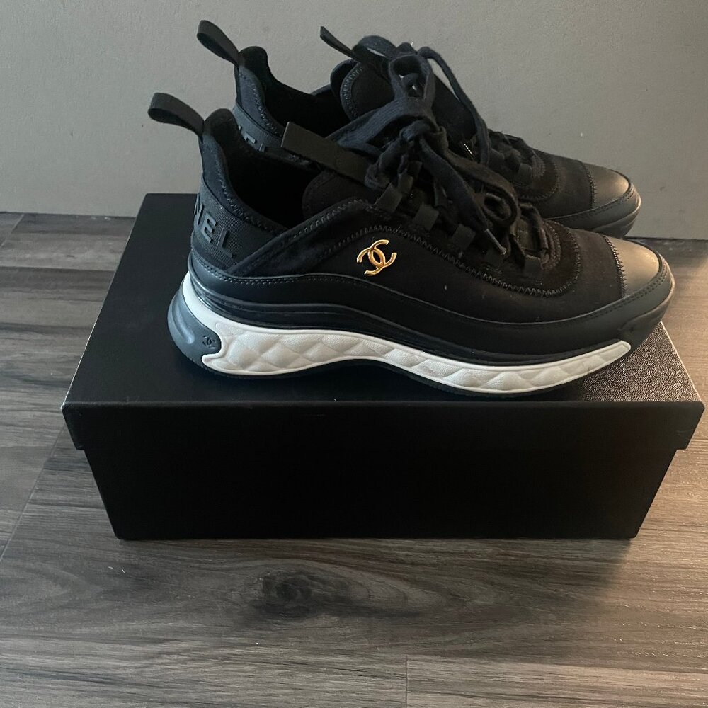 CHANEL Black Sneakers with White Soles and Gold Logo